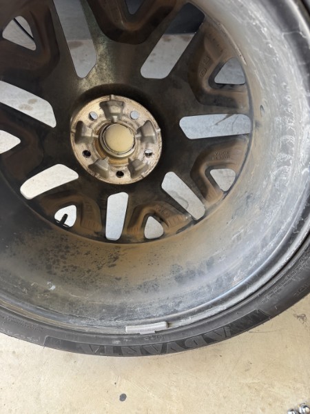 Wheel caked in brake dust before cleaning
